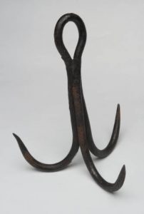 This hook was once used on a "grab rope' to retrieve the bucket in UNC's Old Well whenever the bucket became ditached from its pullet rope or chain."Treble hook, wrought iron. 1800s, from UNC's Old Well," in North Carolina Collection, Wilson Library, UNC-Chapel Hill.